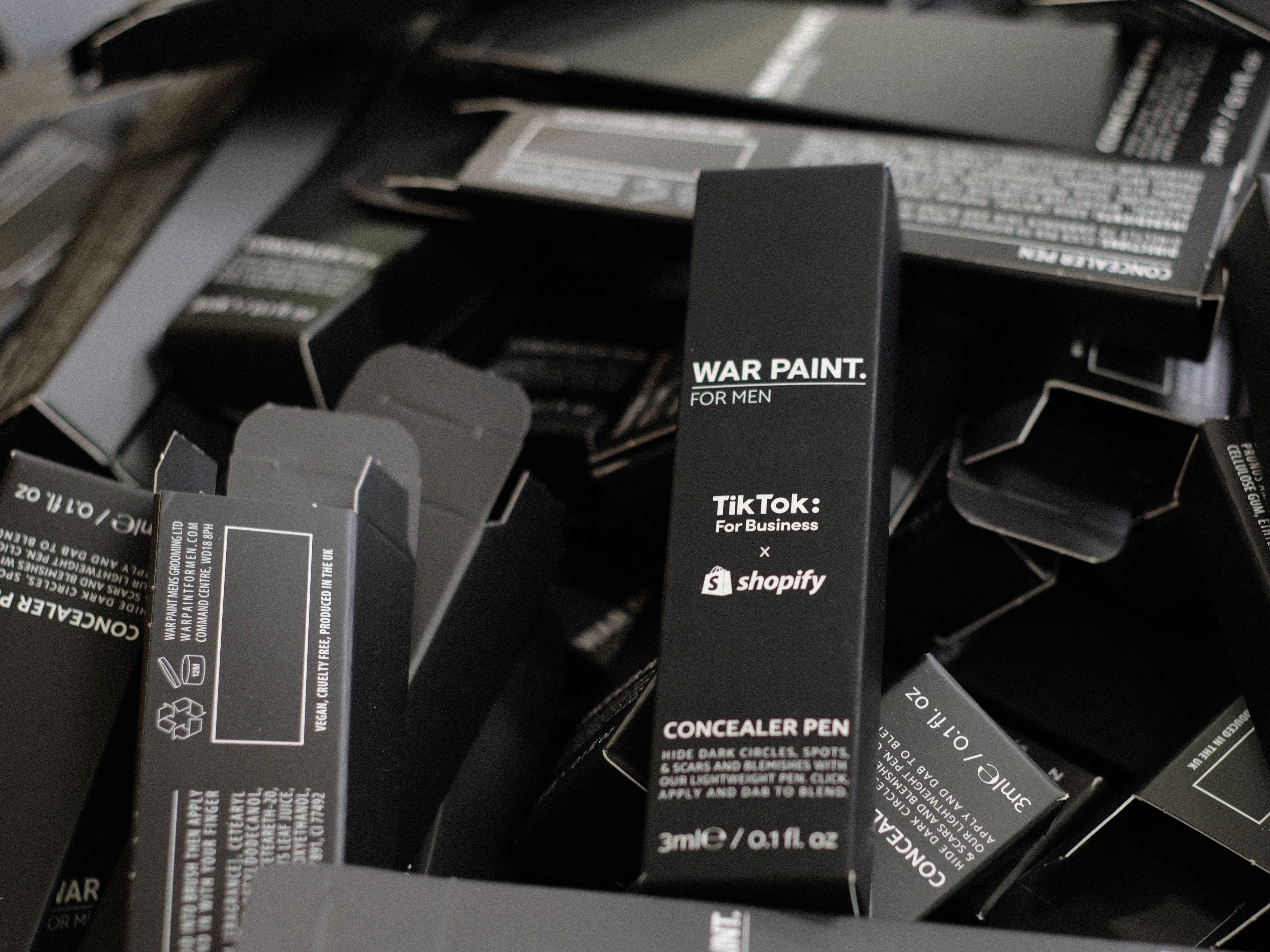 TikTok_Shopify_WArPaintpartnership_logo-min.jpg
